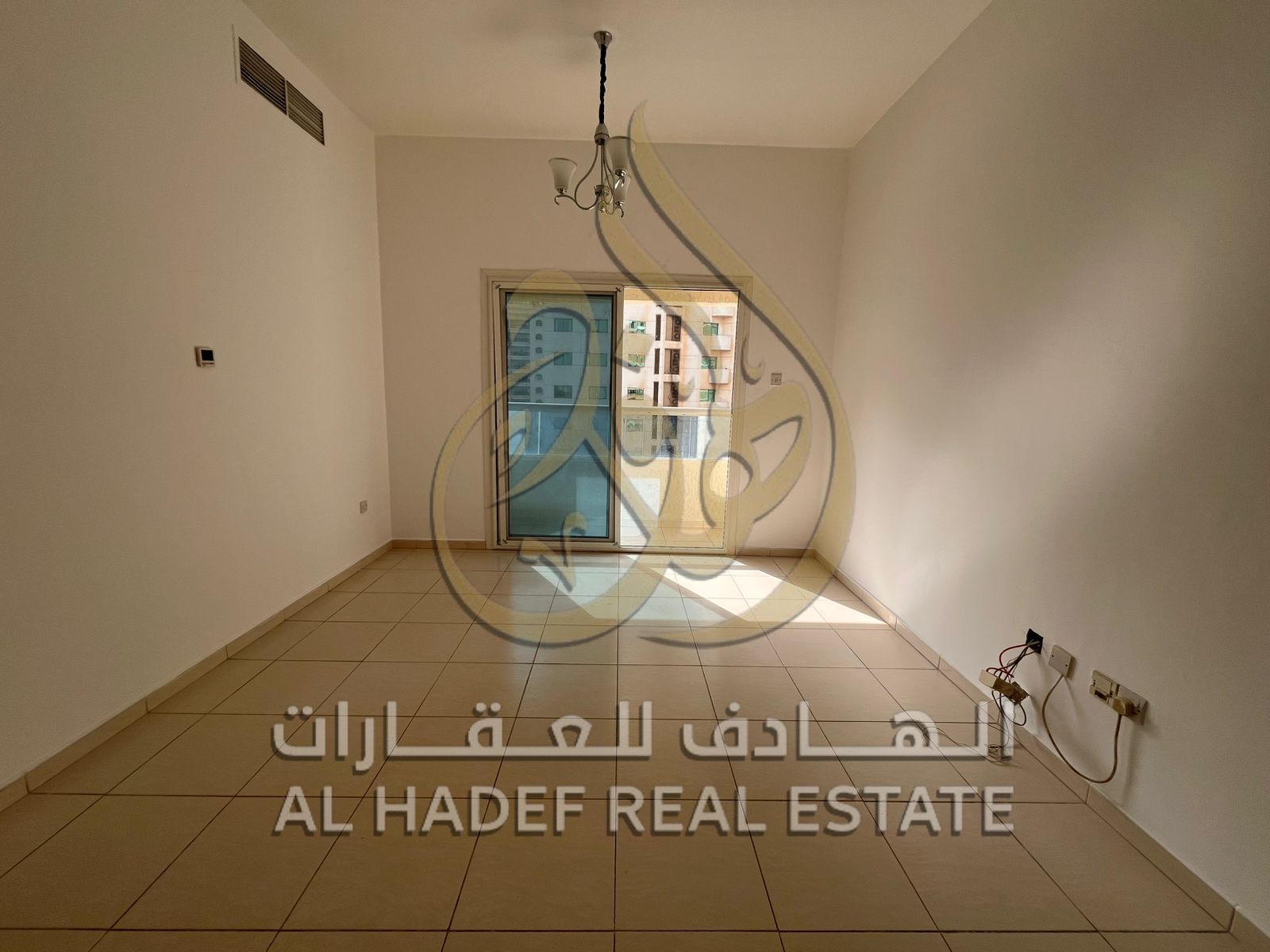 For rent in Sharjah - Al Majaz 3, a one-bedroom apartment with a smart home system and a direct sea view, suitable for individuals or couples looking
