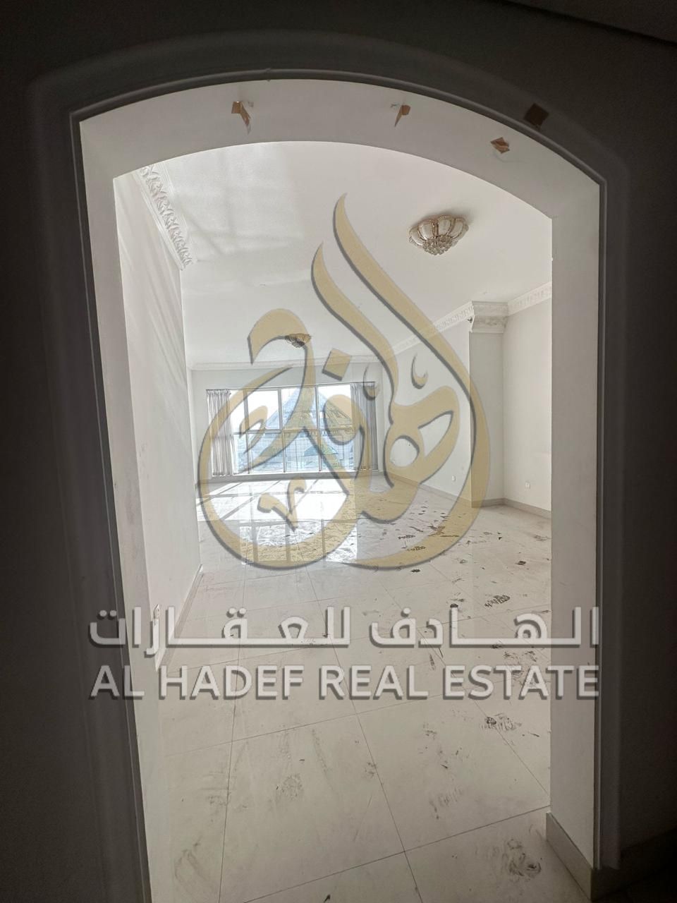 3-bedroom apartment with a living room, free parking, free children's walkway, and maid's room in a strategic location in Al Qasimia.