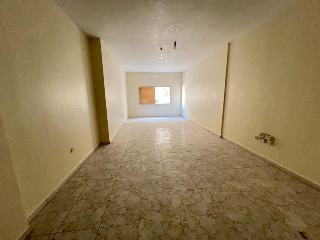 Three-bedroom apartment with living room and spacious layout | Two balconies overlooking the main street | Central AC | Direct Dubai exit