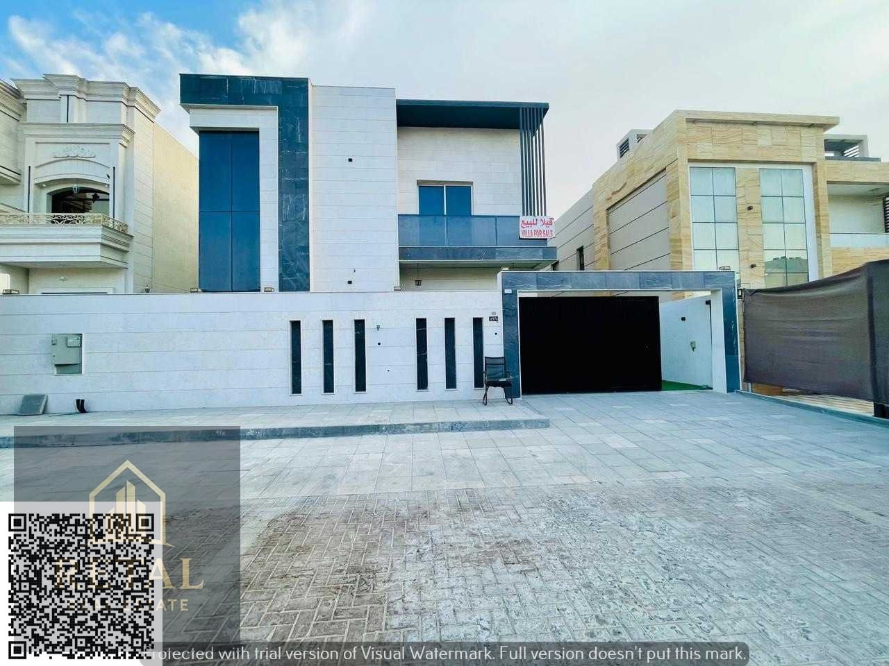 Brand new luxury villa in Al Alia Ajman with modern design, 5 master bedrooms, private pool, waterfall, 2 kitchens, and ample parking spaces