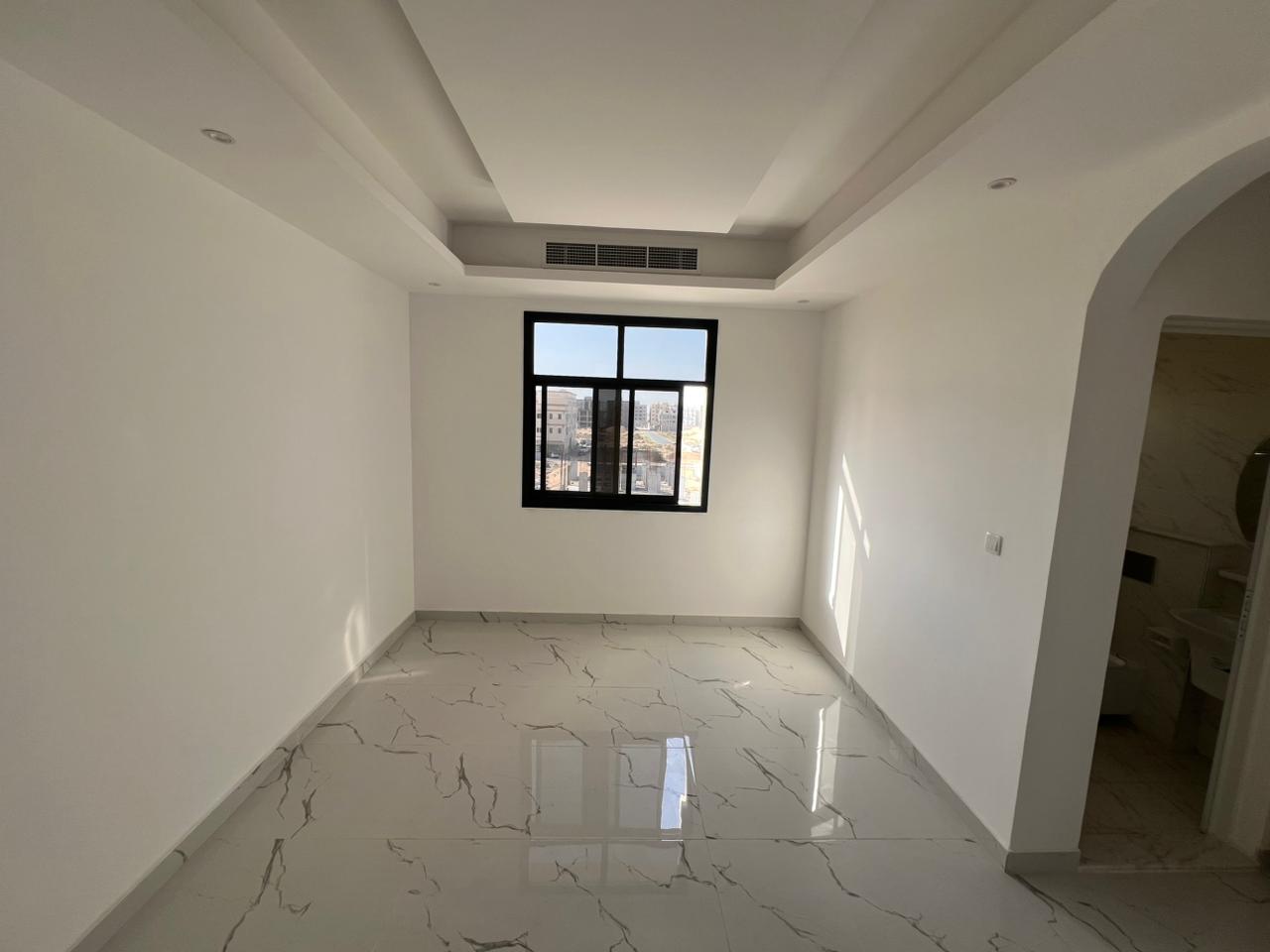Brand new apartment, first occupancy, in Al-Aliya, near Mohammed Bin Zayed exit. Central air conditioning.