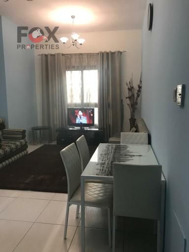 Two-Bedroom Apartment with Living Room for Annual Rent in Emirates City, Garden View, Free Parking, and Prime Location Near Mohammed Bin Zayed Road