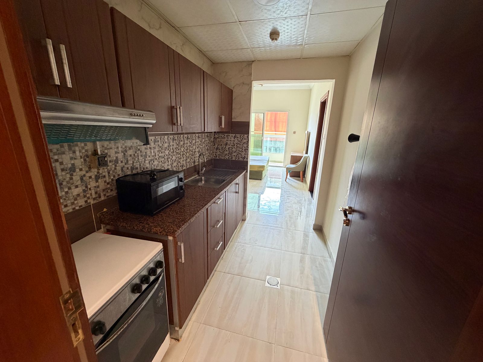 A brand new studio apartment with a balcony, open view, and semi-separate kitchen – one of the most beautiful and largest studios available – close to