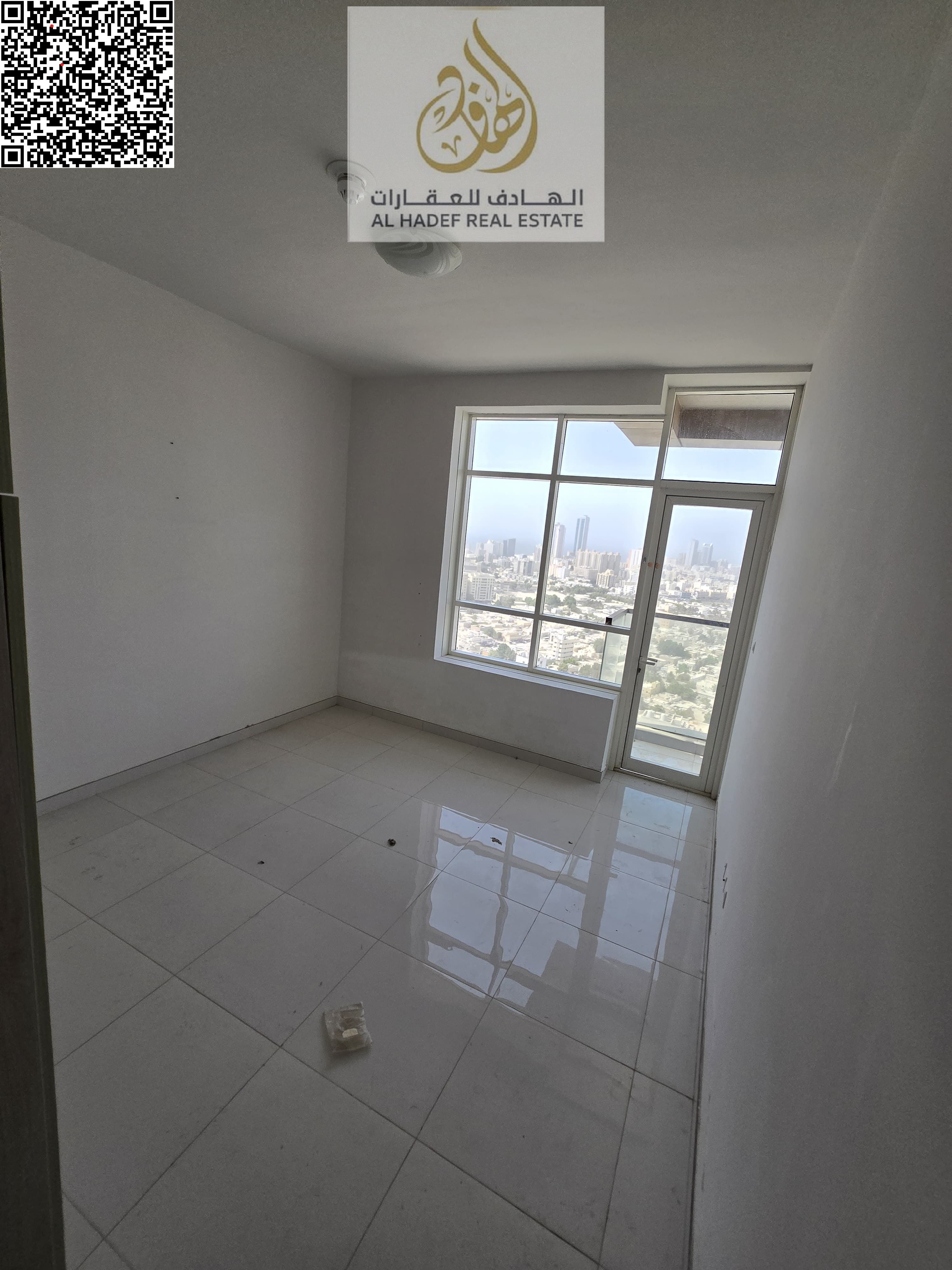Two bedrooms and a living room with a balcony, two bathrooms, and a built-in wardrobe. Located directly on Khalifa Street, near Verona Roundabout.