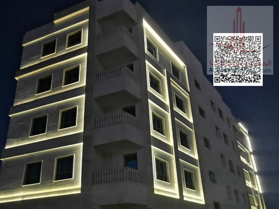 Two-bedroom apartment with a living room for annual rent in Al Nuaimiya area. Excellent location, new building, and reasonable price.