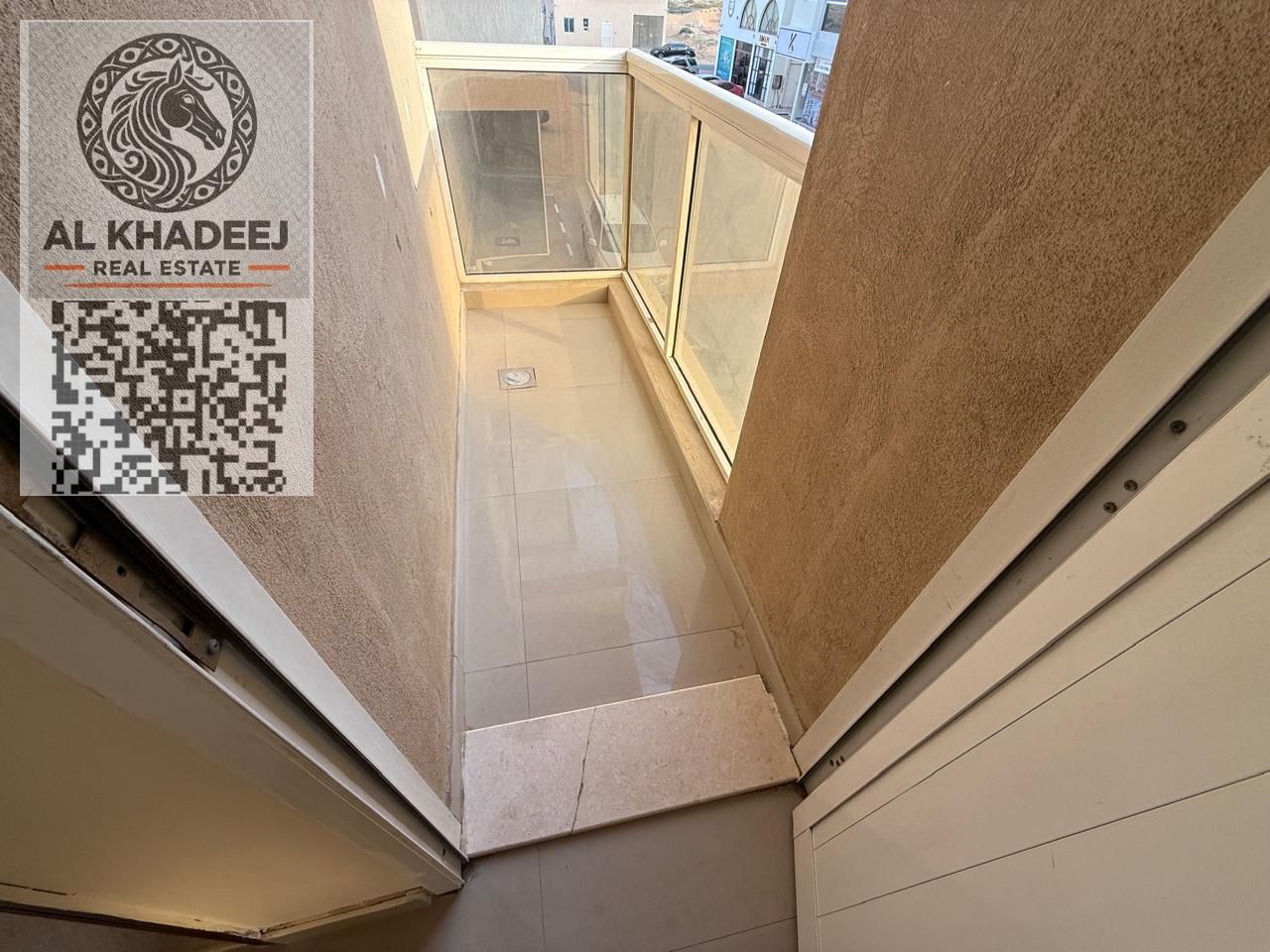 One bedroom and living room with a balcony offering an open view in the Al-Aliya area of Ajman, near the Dubai and Sharjah exit.