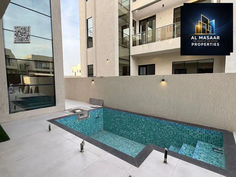 Modern villa in a happy Al Yasmin area with a private pool and rooftop, 7 master bedrooms, personalized finishing, and freehold ownership for all nationalities.