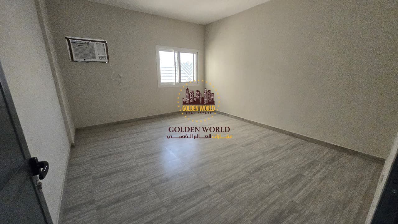 Two-bedroom apartment in Al Majaz 2, Sharjah with 2 living rooms, balcony, 2 bathrooms, split AC, no parking. Family-only, 24/7 security, CCTV, centra