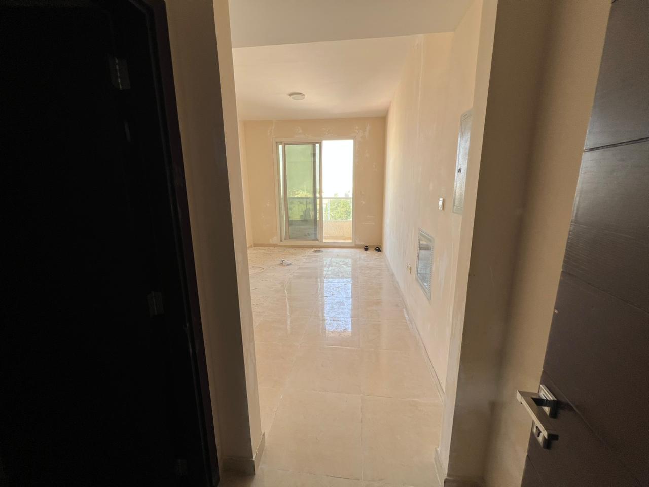 A two-bedroom apartment with a living room is available for annual rent in the Al Nuaimiya area