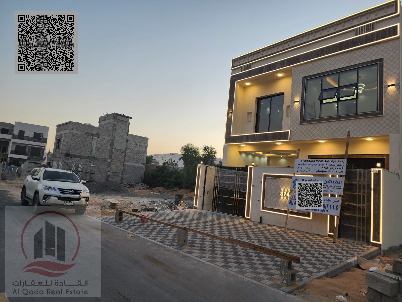 Villa for sale in Ajman, Al Helio area, including registration, 5 master bedrooms, majlis, living room, maid's room, roof terrace, and bank financing.