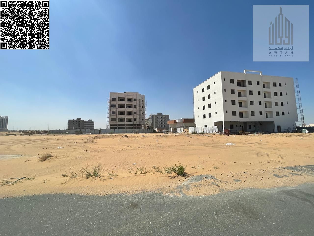 Residential/commercial land for sale in Ajman, Al Alia Global City area. Land area: 4305 sq ft. Building permit for ground floor + 4 floors. Freehold