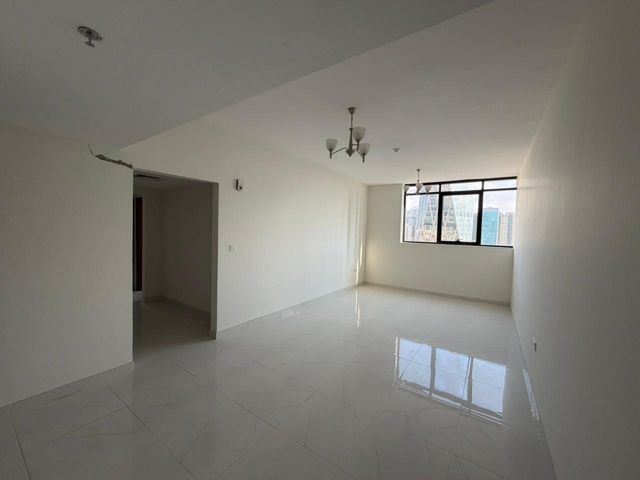 First tenant | Free parking – The most beautiful 2-bedroom apartment with a living room in Al Mamzar, featuring a balcony with an open view.