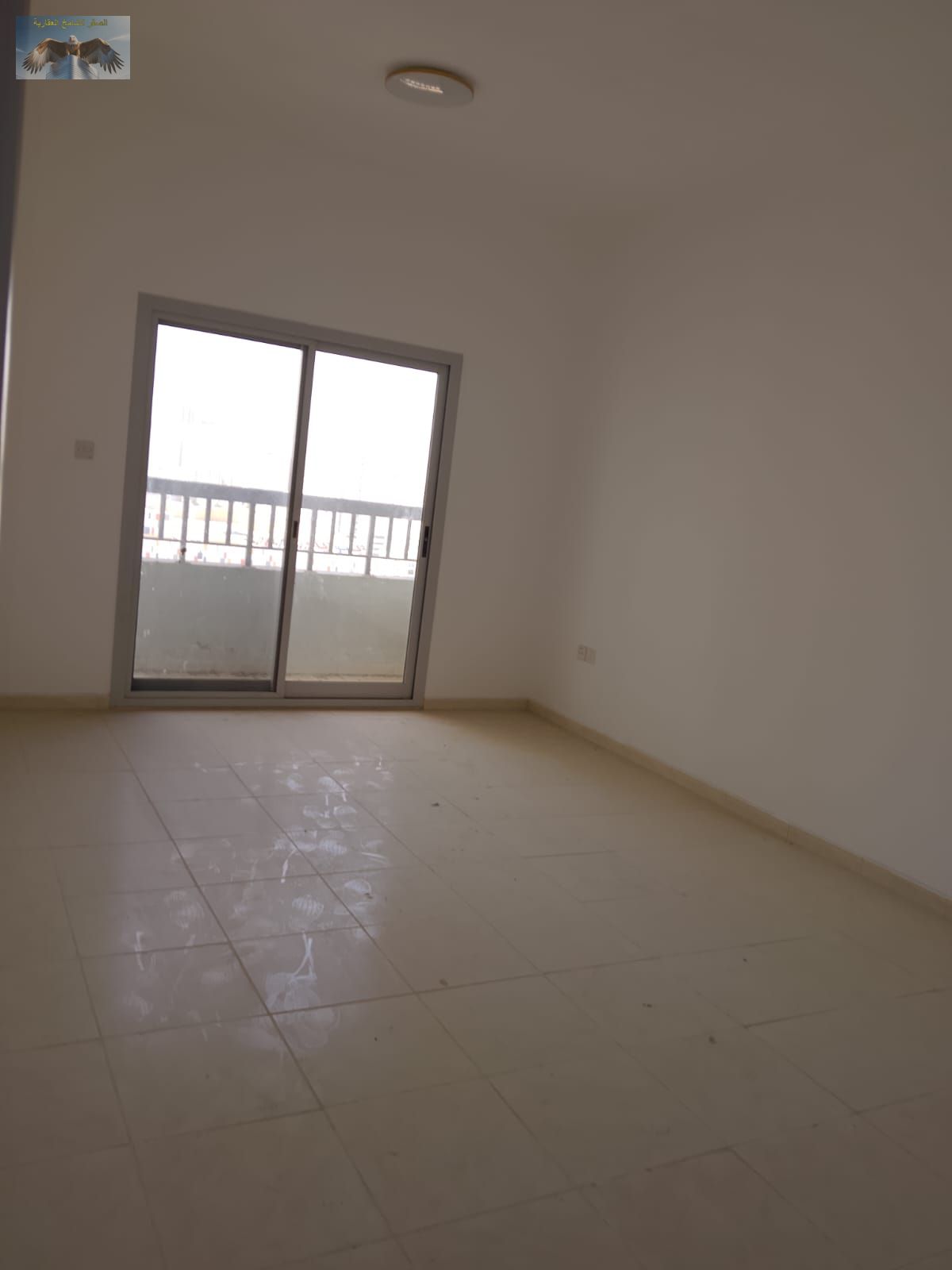 A two-bedroom apartment with a spacious living hall, featuring a separate salon and a balcony with an open view that provides excellent natural light