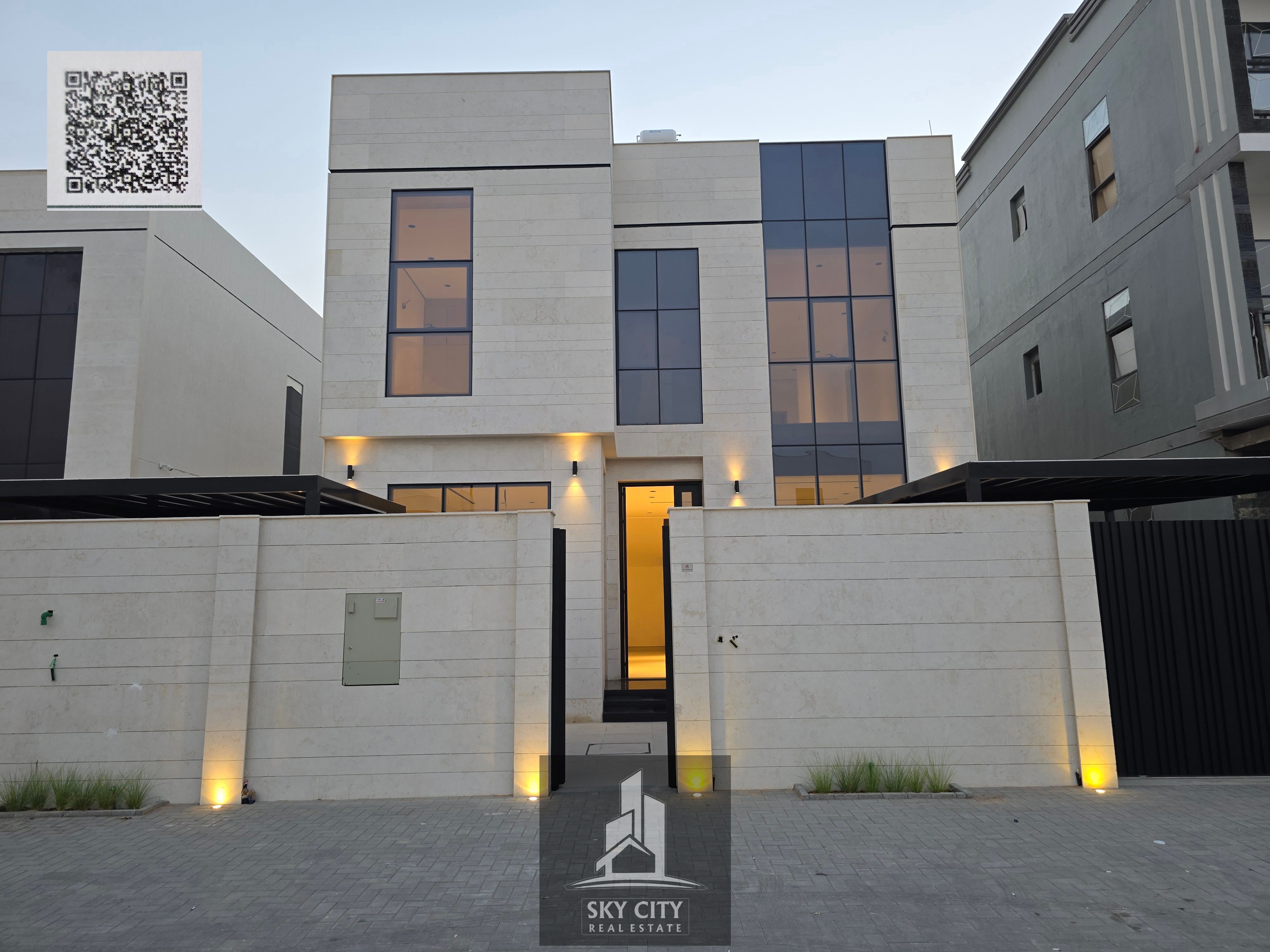 Al Zahia, behind the Emirates Towers on Sheikh Mohammed Bin Zayed Road. Ground floor, first floor, and roof. 4 master bedrooms, majlis, 2 living rooms, maid's room, large setback in front of the villa with a yard.