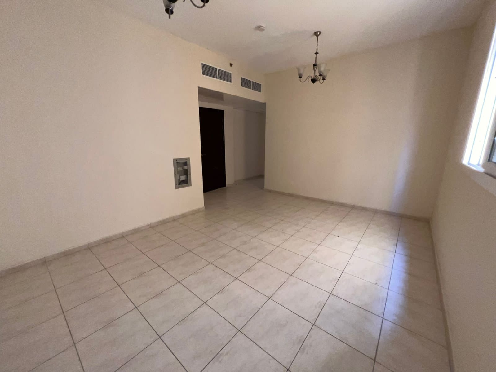 Two-bedroom apartment with hall for annual rent, central AC, free maintenance, spacious layout, prime location, 4/6 payments.