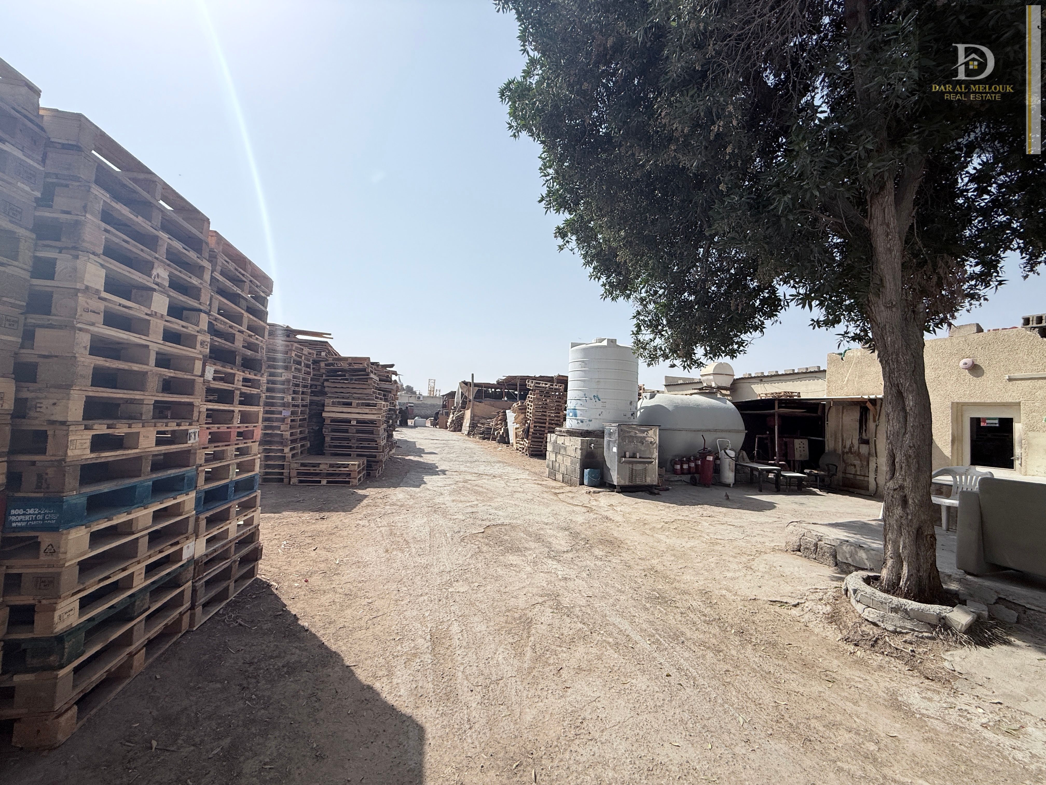 A walled plot of land for rent in Sharjah, Al Sajaa Industrial Area.