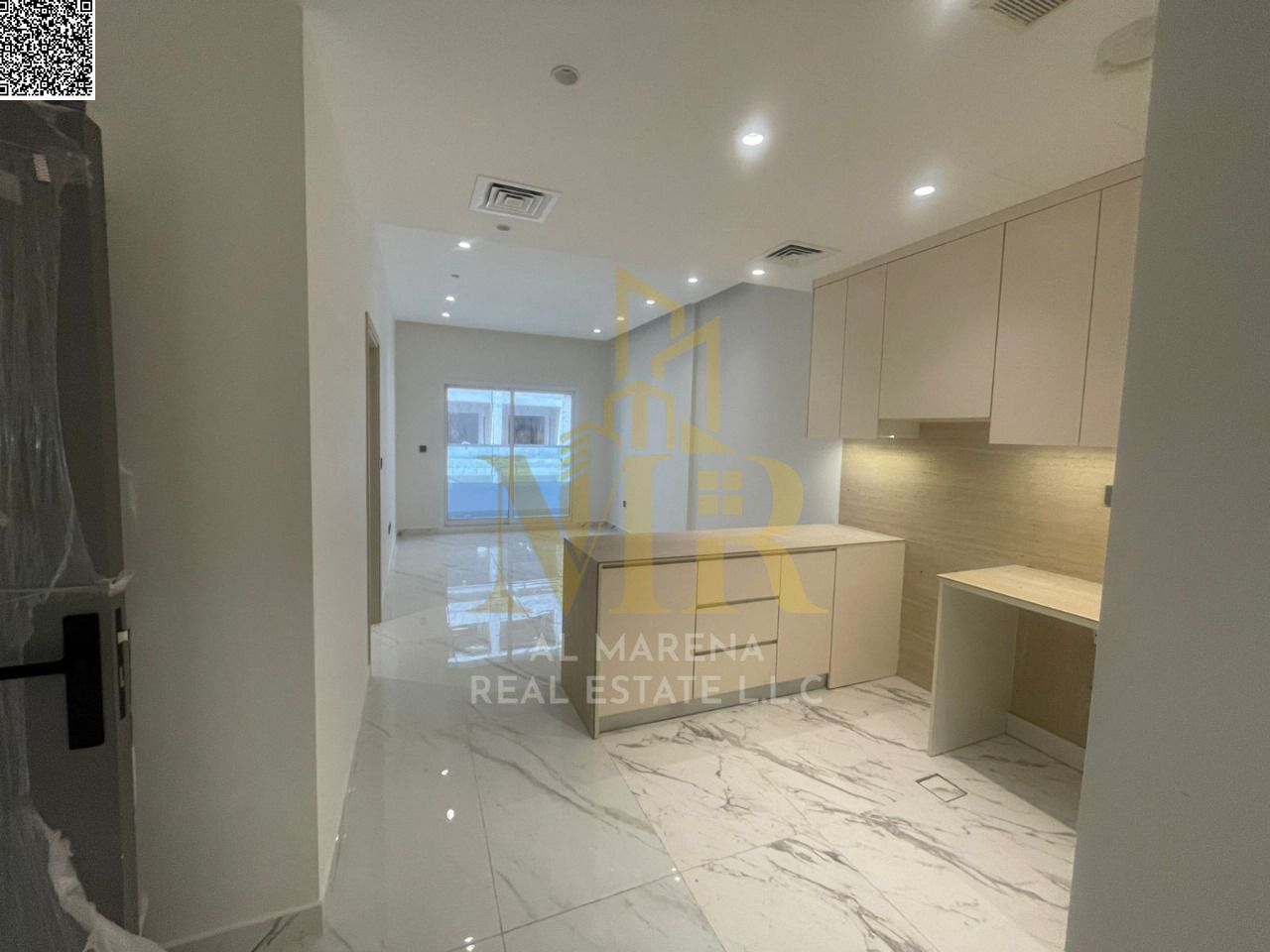 For sale: A distinctive one-bedroom apartment in Emirates City with a stunning view, private parking, and a convenient payment plan. Modern design and