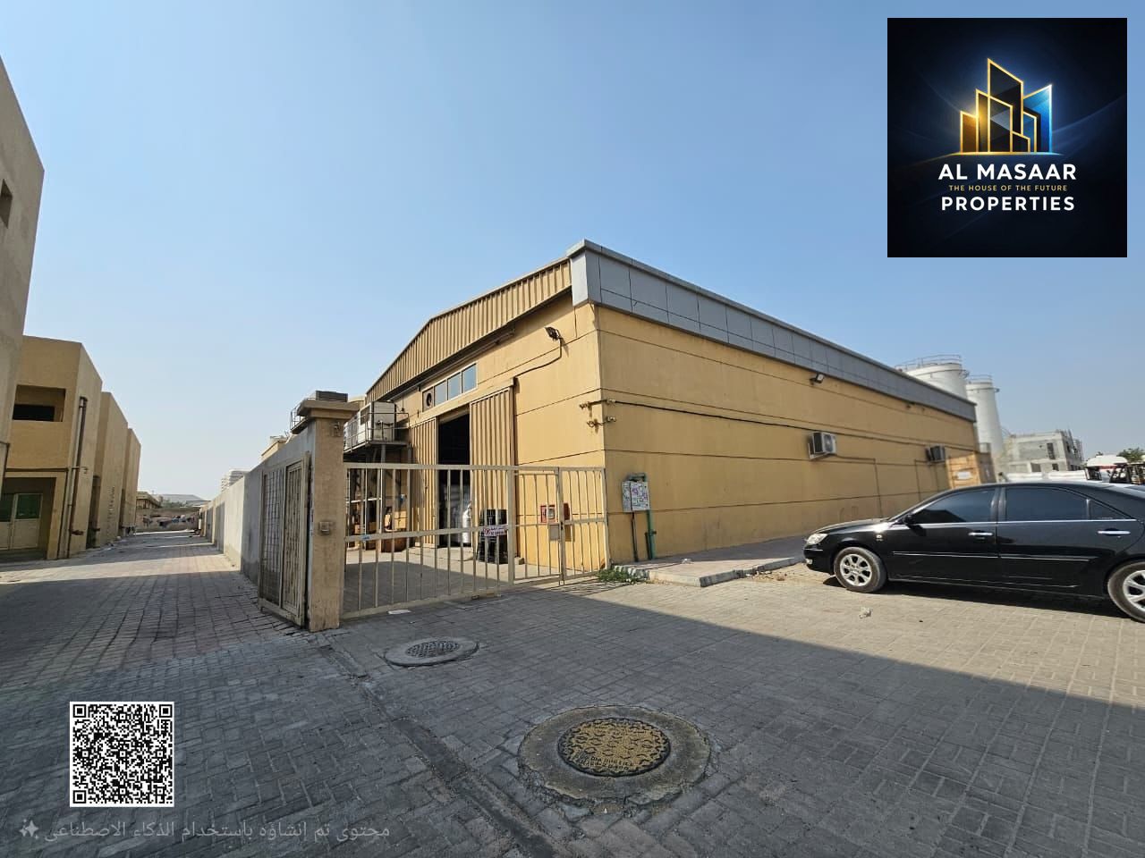 Warehouse for sale in Ajman, Al Jurf area, with fully rented workers' accommodation.