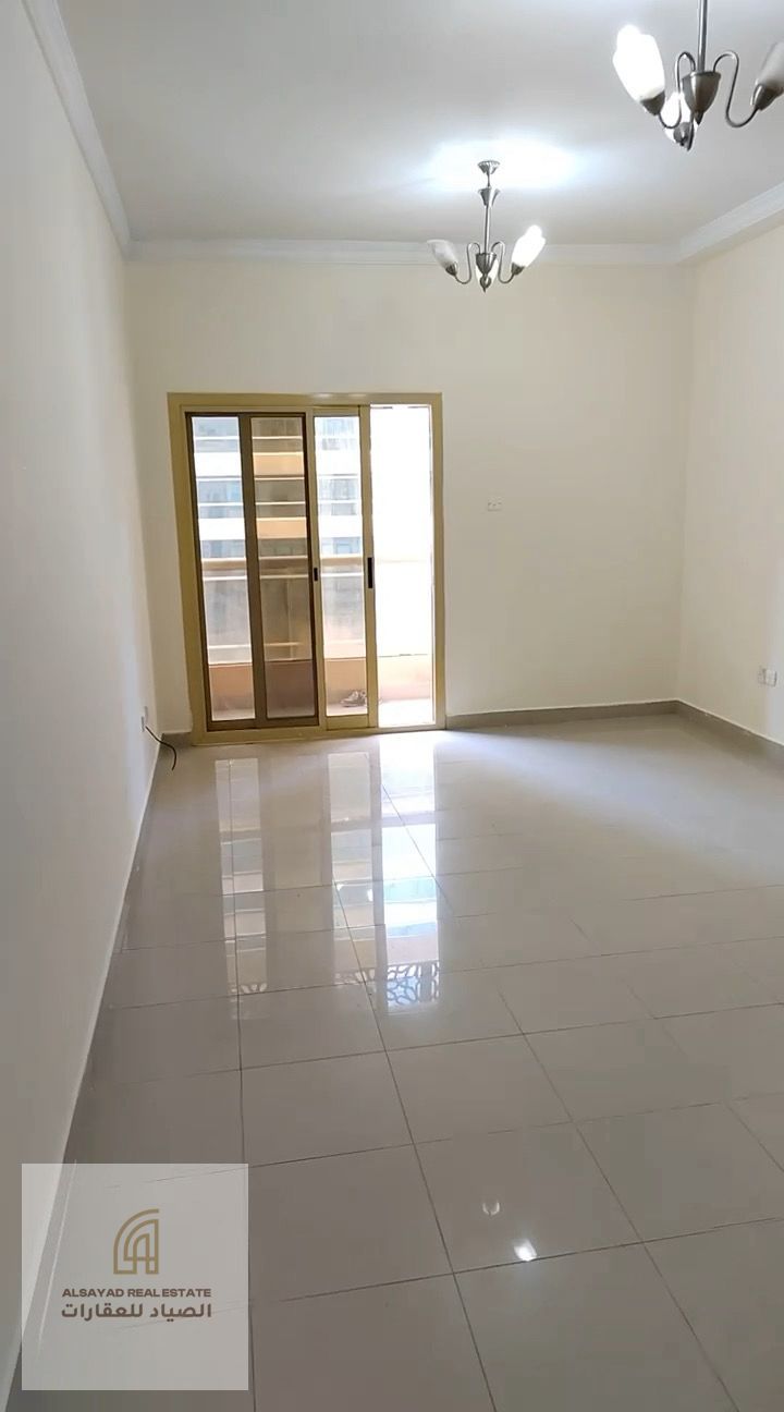 Two bedrooms and a living room located in Al Qasimia Tower, Manazel 1