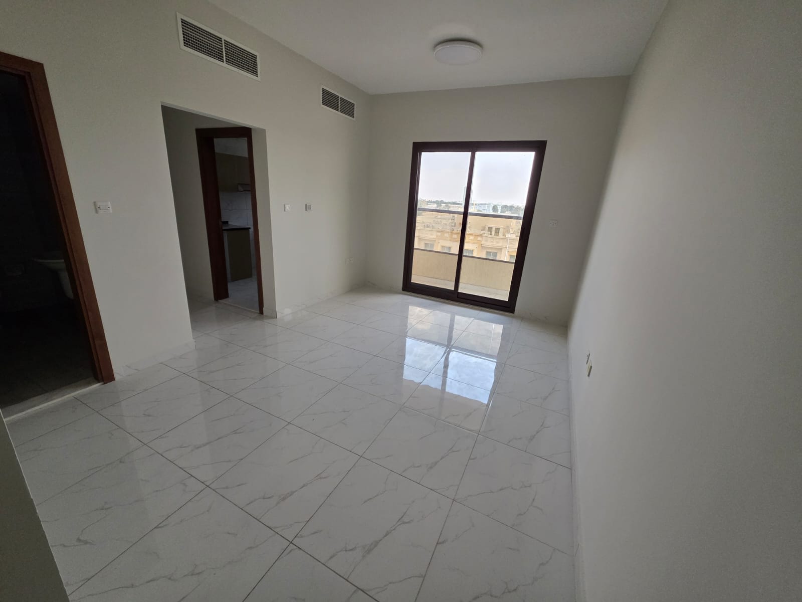Ideal apartment for families in Al Rawda, Ajman, two bedrooms and a living room, central location and integrated services