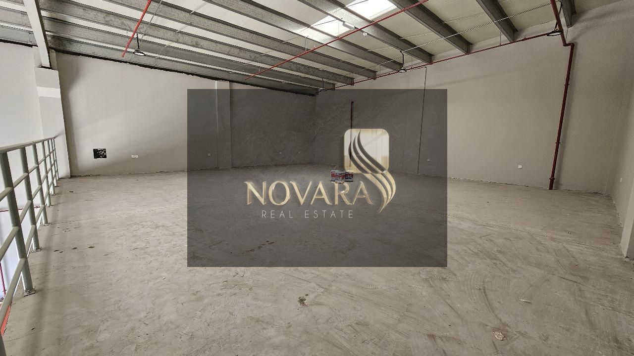 A distinctive warehouse for rent in Al Jurf Industrial Area 3, Ajman, with an area of 3500 feet, a mezzanine, 30 kW electricity, and a large loading