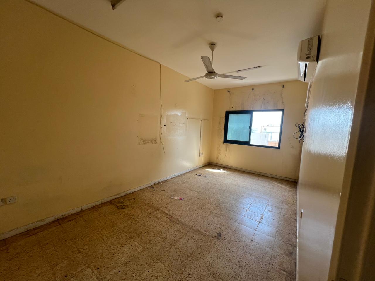 Cheapest 1 bedroom apartment with living room in Al Qulayaa for annual rent 28,000 AED. Split AC, spacious layout, prime location, free maintenance,