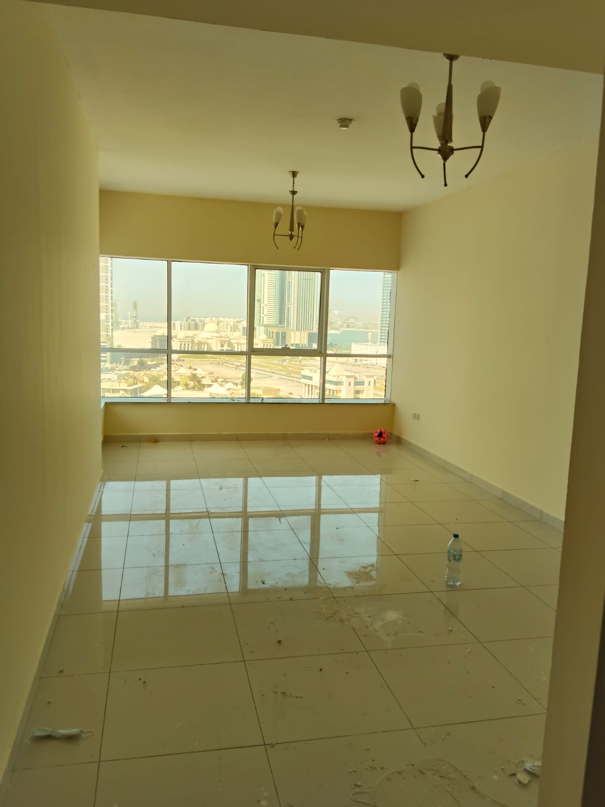 A spacious one-bedroom apartment with a living room, overlooking the sea, located in Al-Taawun, close to the Corniche.