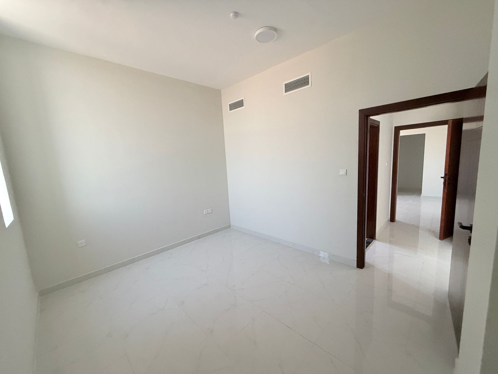Two-bedroom apartment with a living room for annual rent in Ajman. Master bedroom with two bathrooms and a balcony. 40,000 AED payable in 6 installmen
