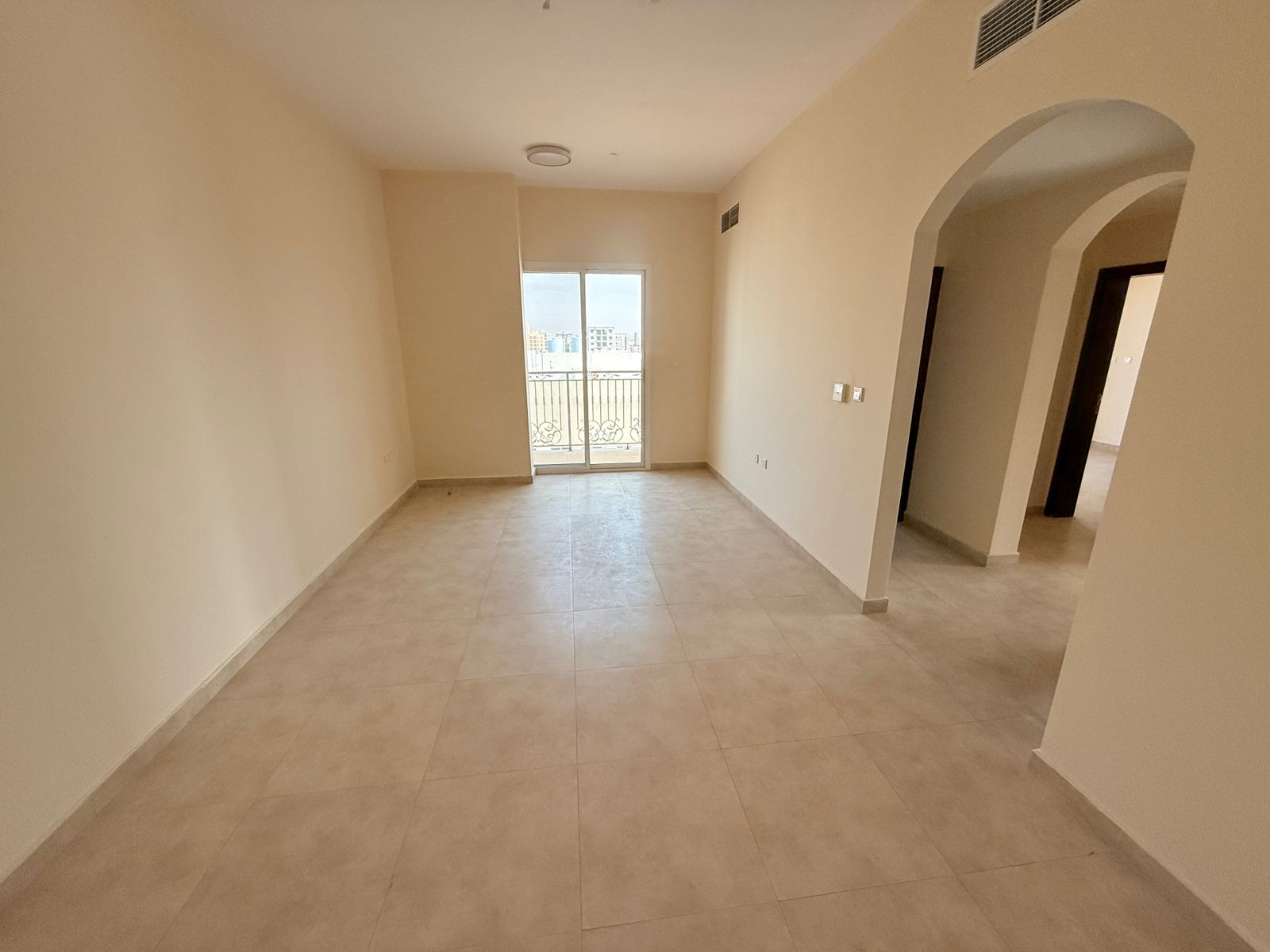 Two bedrooms and a living room with a balcony,