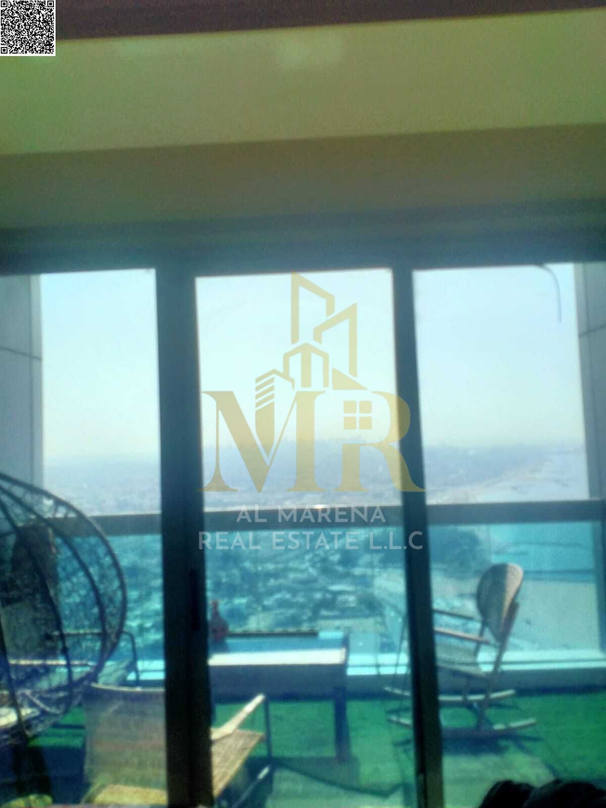 Apartment for sale on Ajman Corniche with a direct sea view, one bedroom and living room with an elegant design, prime location close to services, an