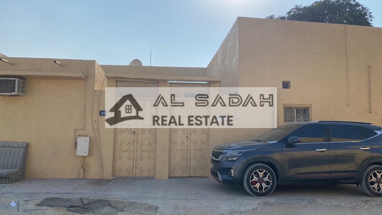 An Arabic house for sale in Sharjah, Al Sabkha area. The house is 2,500 square feet.  The house is divided into two sections.  The first section includes a master bedroom, a living room, a bedroom, two bathrooms, a kitchen, and a small courtyard.  The sec