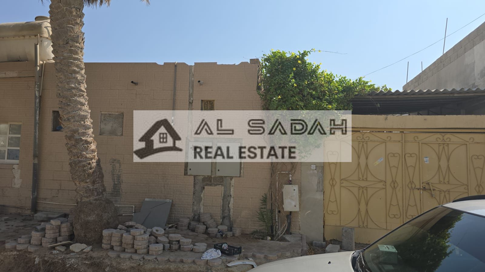 For sale: A house in Umm Khanoor, divided into two sections. The first section has 3 bedrooms, a living room, a majlis (formal sitting room), and a kitchen. The second section has 2 bedrooms, a living room, and a kitchen. It has separate electricity and w