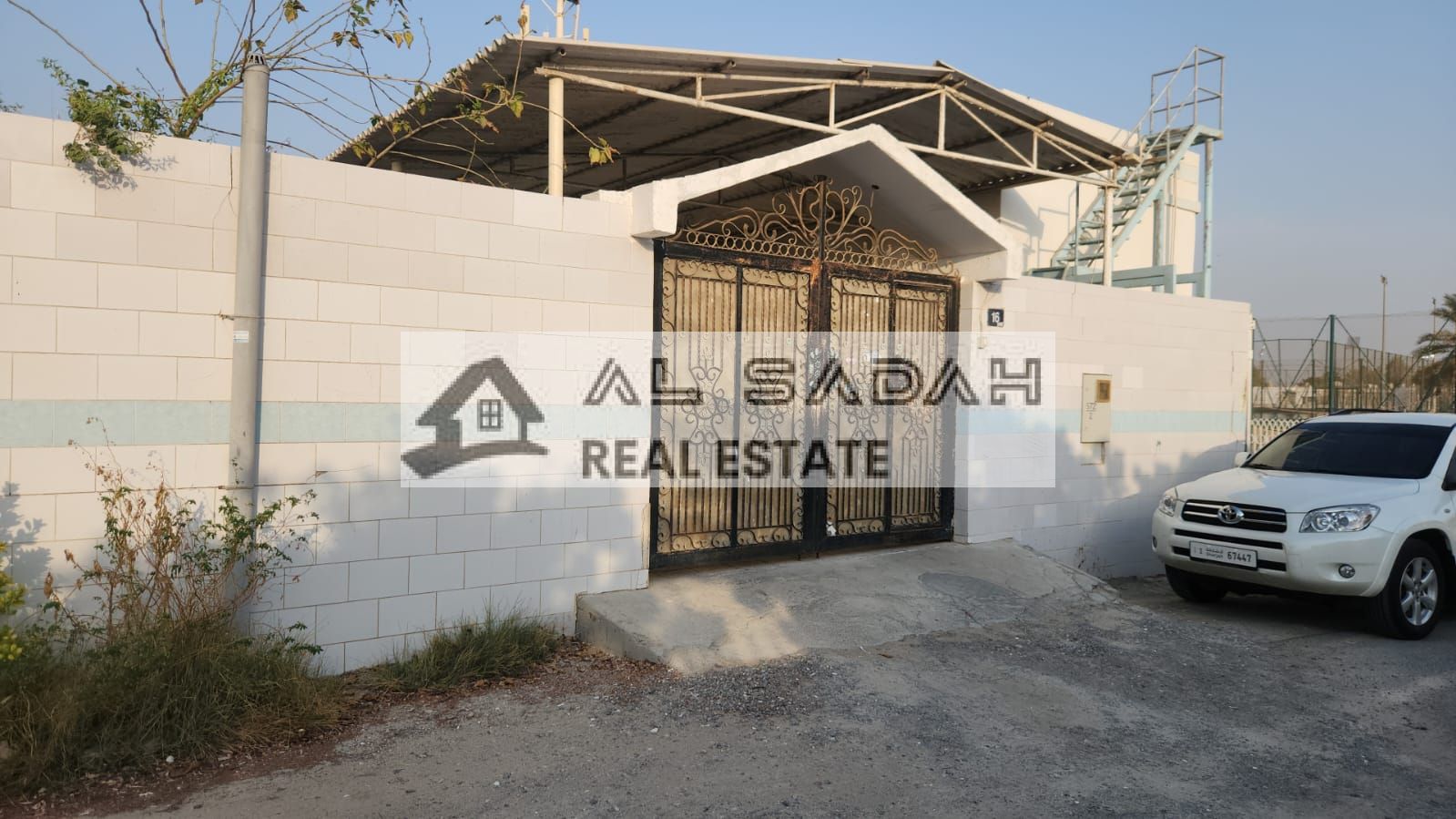 Corner house for sale in Al-Qadisiyah. The house is divided into two sections: the first section has 4 bedrooms, a living room, a majlis (formal sitting room), and a kitchen; the second section has 6 bedrooms, a living room, a majlis, and a kitchen. The t