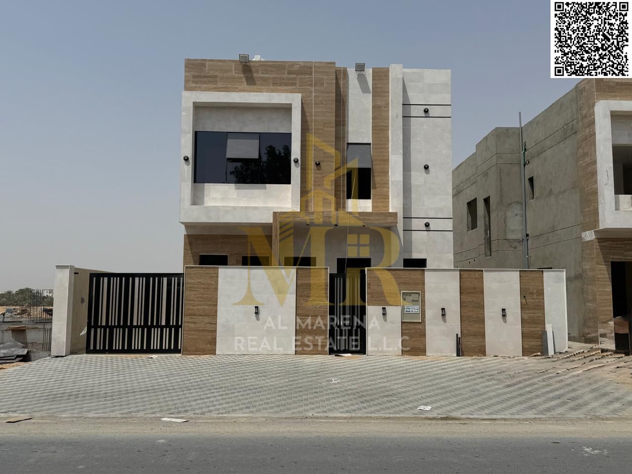 Two-story villa with a terrace, priced inclusive of registration and ownership fees, ready for occupancy in one of Ajman's most prestigious areas, fre