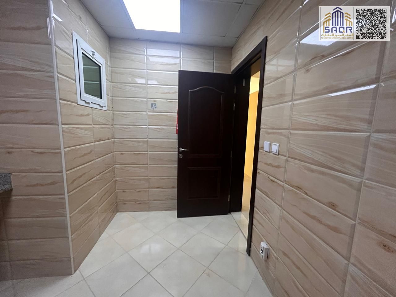 Elegant One Bedroom Apartment with Spacious Living Area Bathroom Built In Kitchen Cabinets Air Conditioning and Gas Included in a Prime Residential L