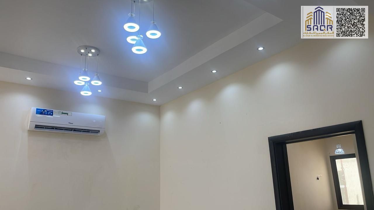 Two-story villa for rent in Al Zahia, Ajman. 4 master bedrooms, 2 living rooms, and a kitchen. AED 80,000