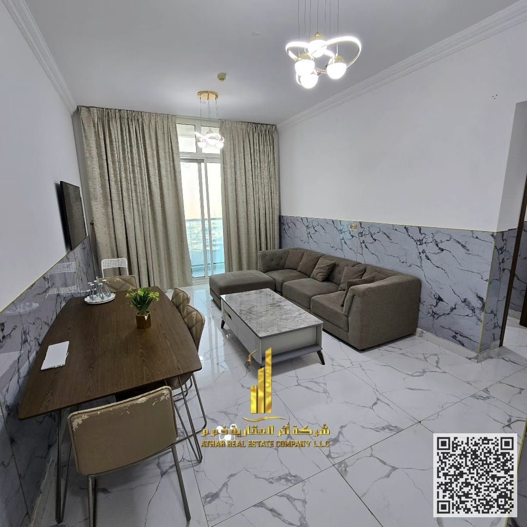 Luxury apartment Two bedrooms, living room, and balcony with sea view, fully furnished, for monthly rent in Ajman, Oasis Tower. Includes utilities