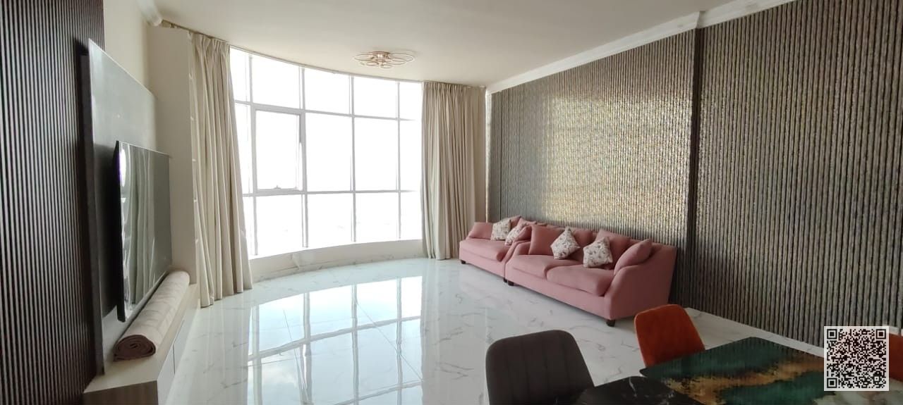 With an open view, a fully furnished two-bedroom apartment with a living room for monthly rent in Ajman Includes bills , gym, pool, and parking.