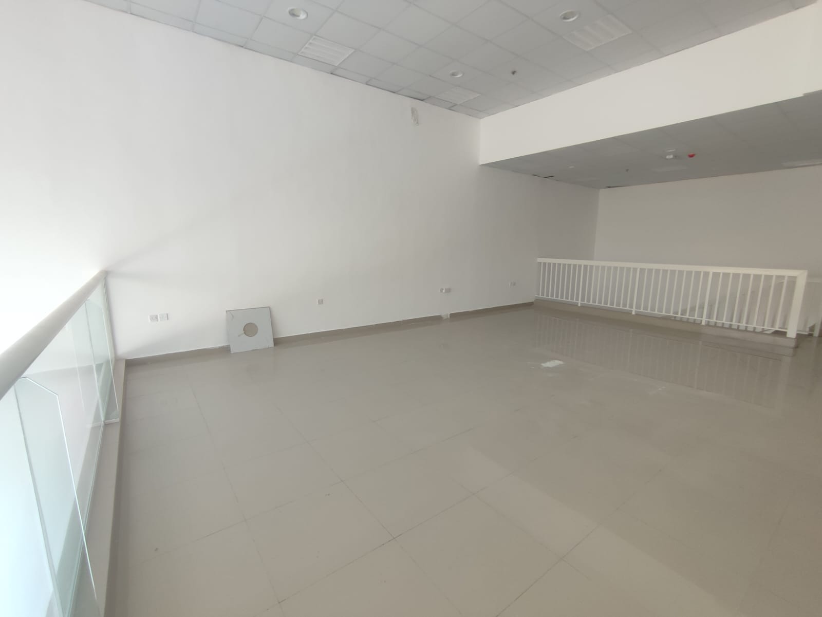 Commercial complex, first occupancy, Ajman Industrial Area, front-facing on the main street