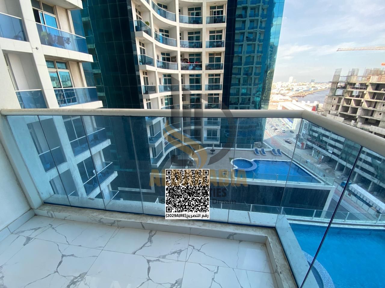 The apartment is located in a well-known residential tower with a prime location close to main roads, shopping centers, schools, mosques, and daily s