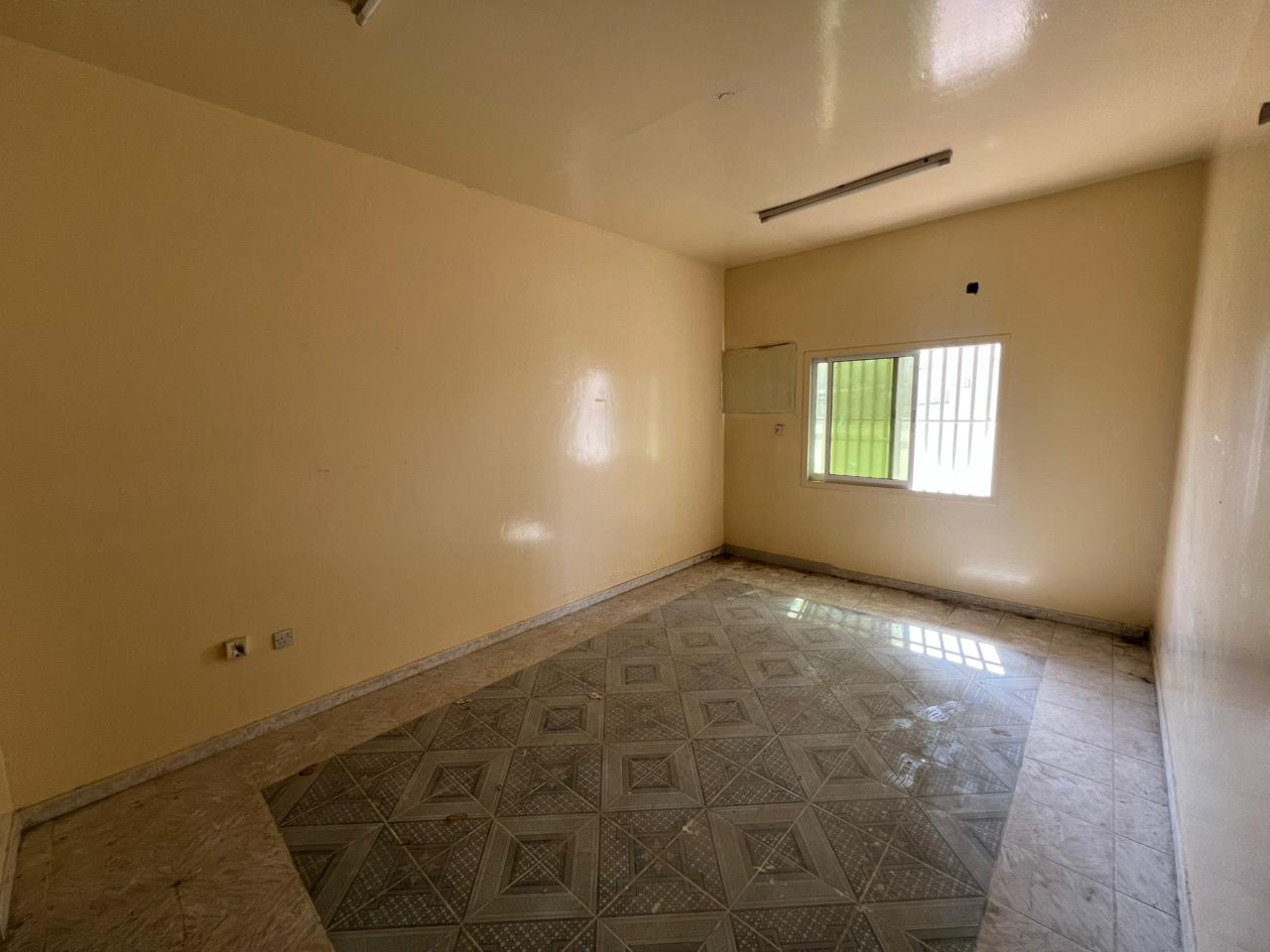 AED 30,000 Yearly For rent: Two-bedroom apartment with living room in Al Nuaimiya Ground floor, close to Kuwait Street Two bedrooms and living room