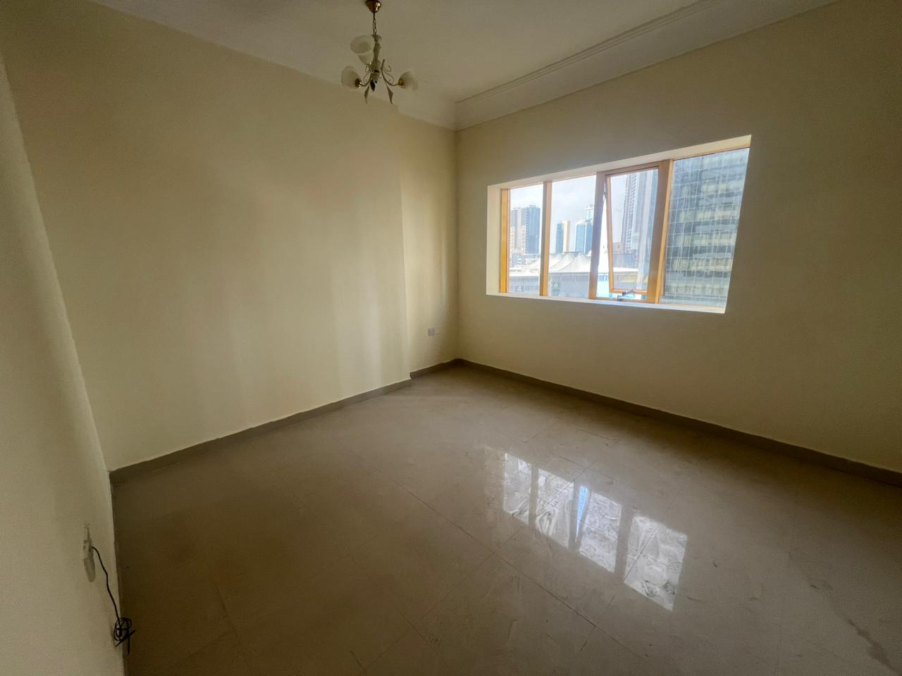 Two bedrooms and a spacious living room in Al Taawun | Free parking | Central air conditioning | Open view | On the Dubai exit | Prime location