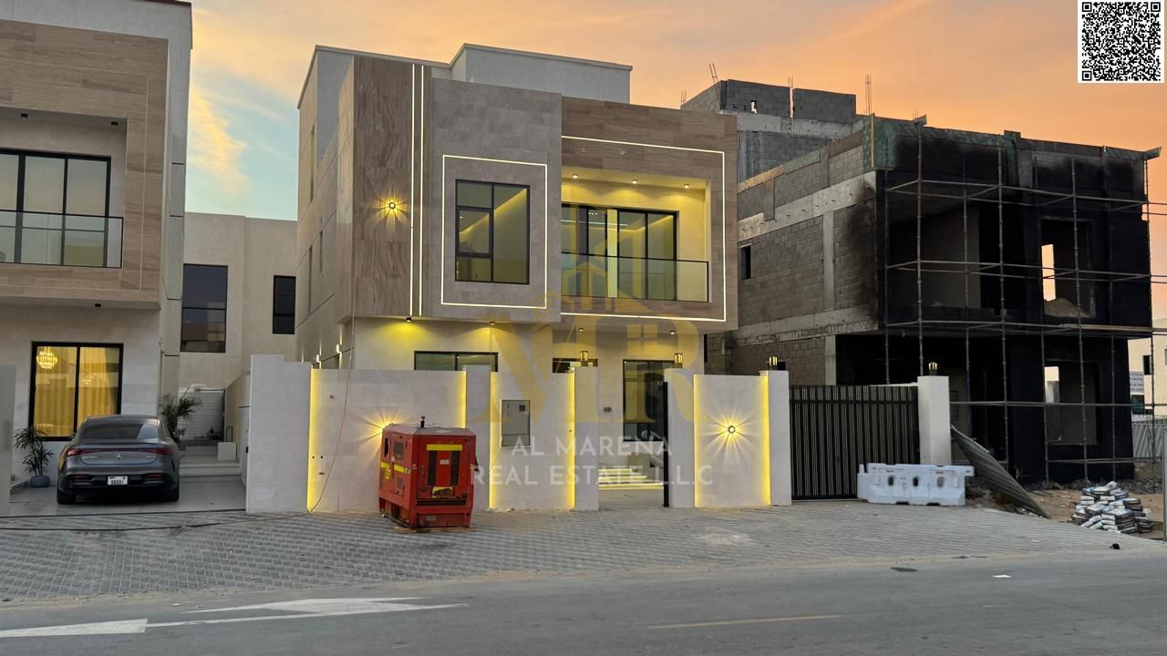 Two-story villa with a rooftop terrace, priced inclusive of registration and ownership fees, ready for immediate occupancy in one of Ajman's most pres