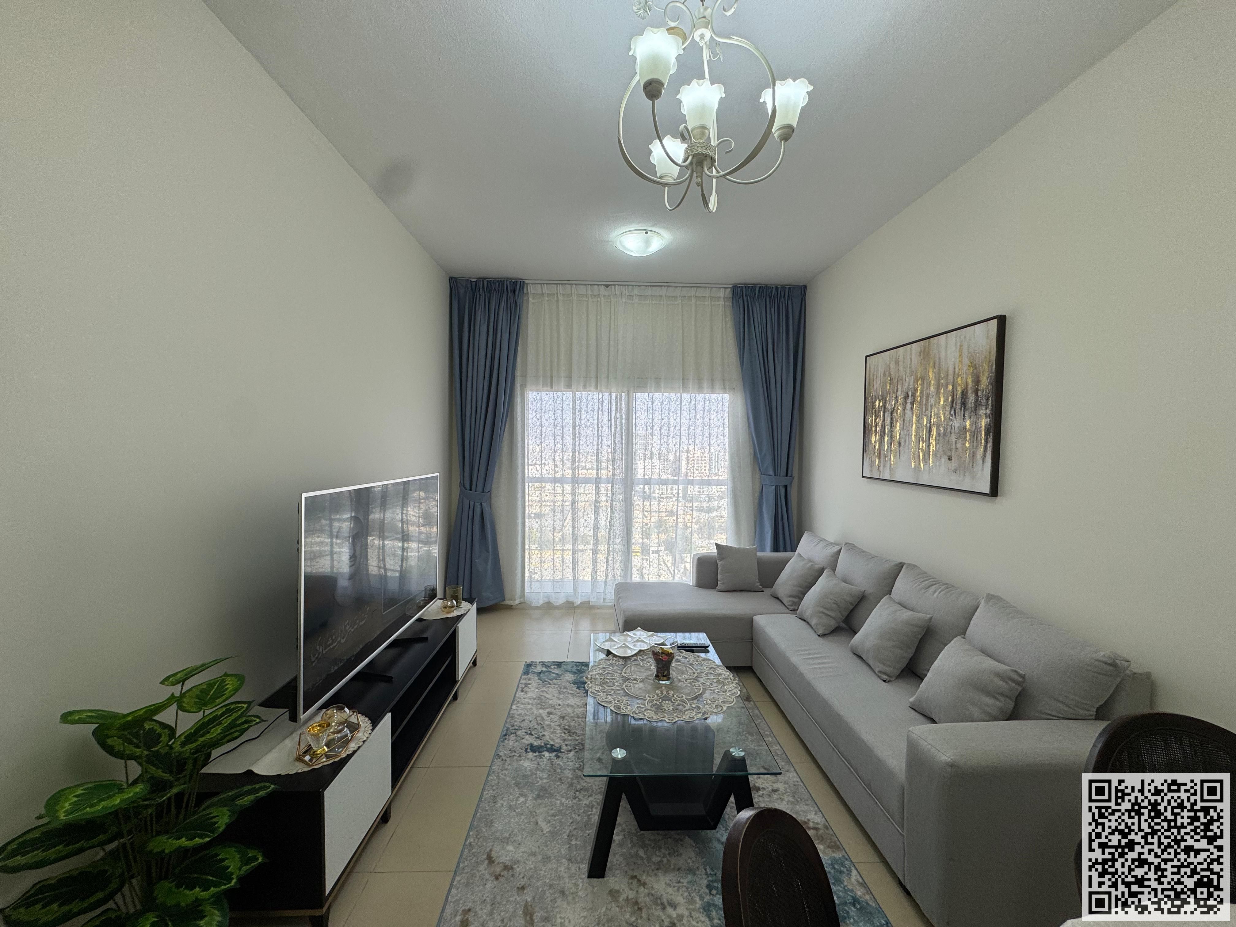 Luxury furnished 2-bedroom apartment with a balcony for monthly rent in Ajman, Al Yasmin Towers. Includes utilities, internet, and parking.