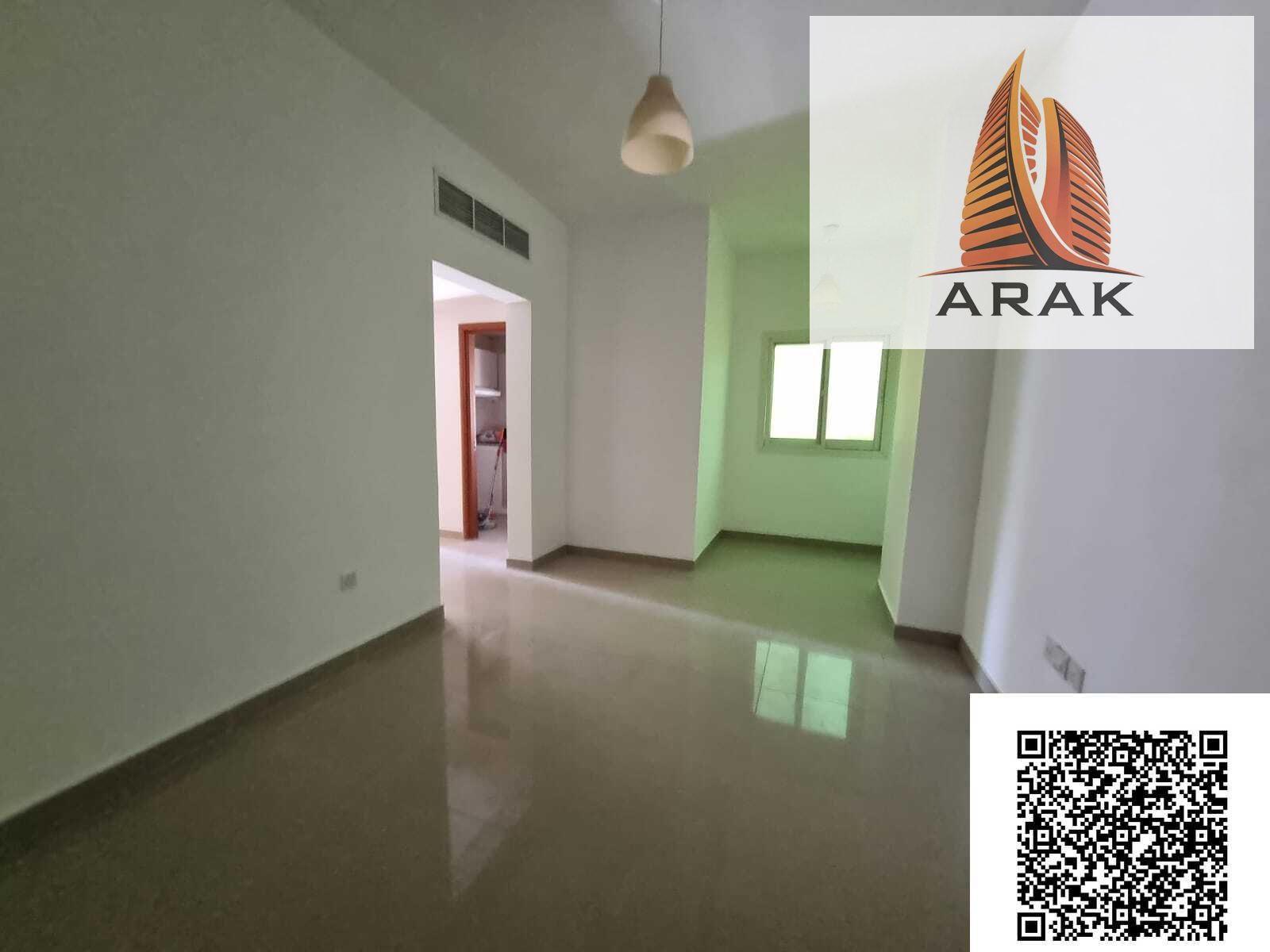 A two bedroom apartment with a living room is available for annual rent in Al Rashidiya 3, located on Old Traffic Street, Ajman. The area is lively