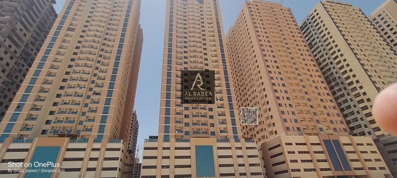 Two bedrooms and a living room in Emirates City, with two bathrooms and a kitchen, overlooking the garden and Mohammed Bin Zayed Road, for 35,000 AED