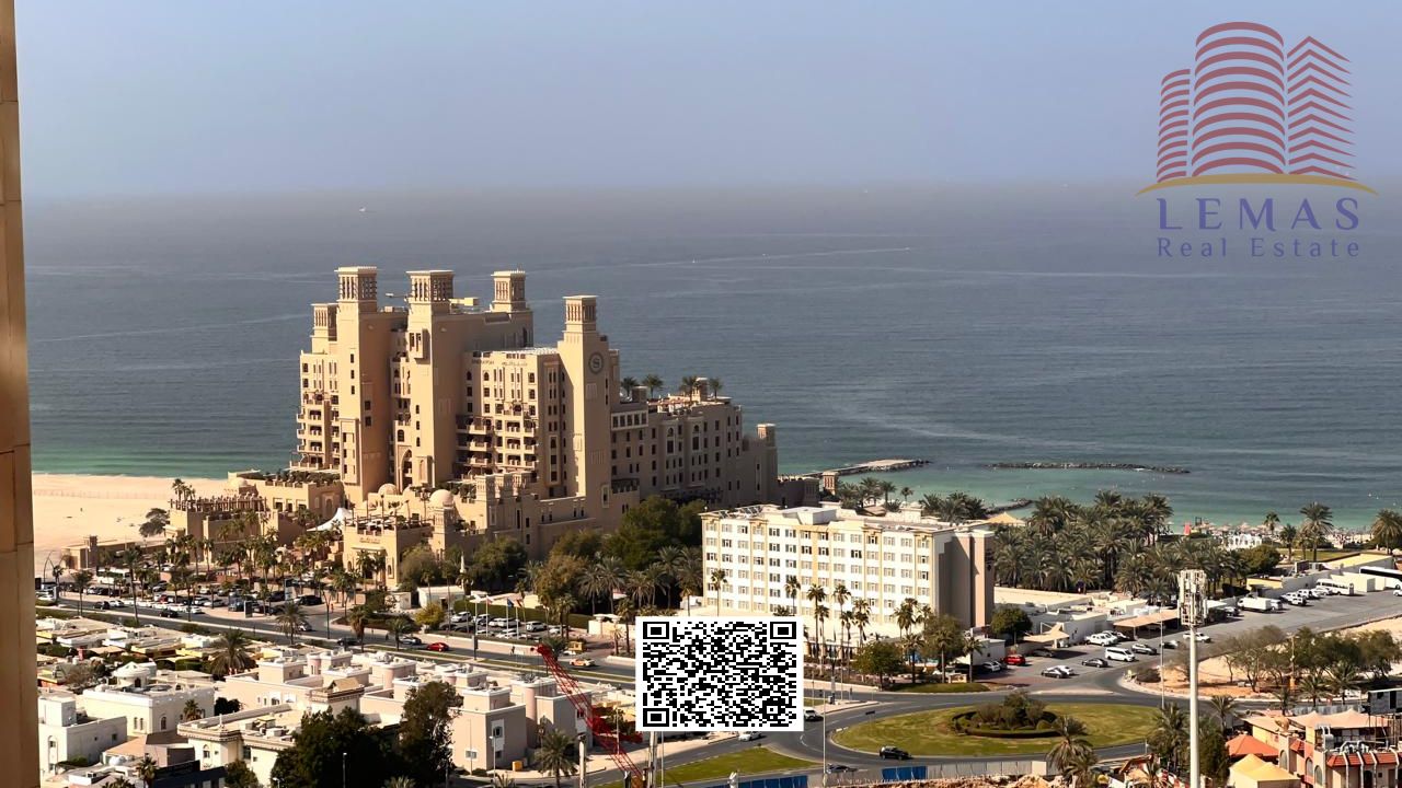 Two-bedroom apartment with a living room and partial sea view.