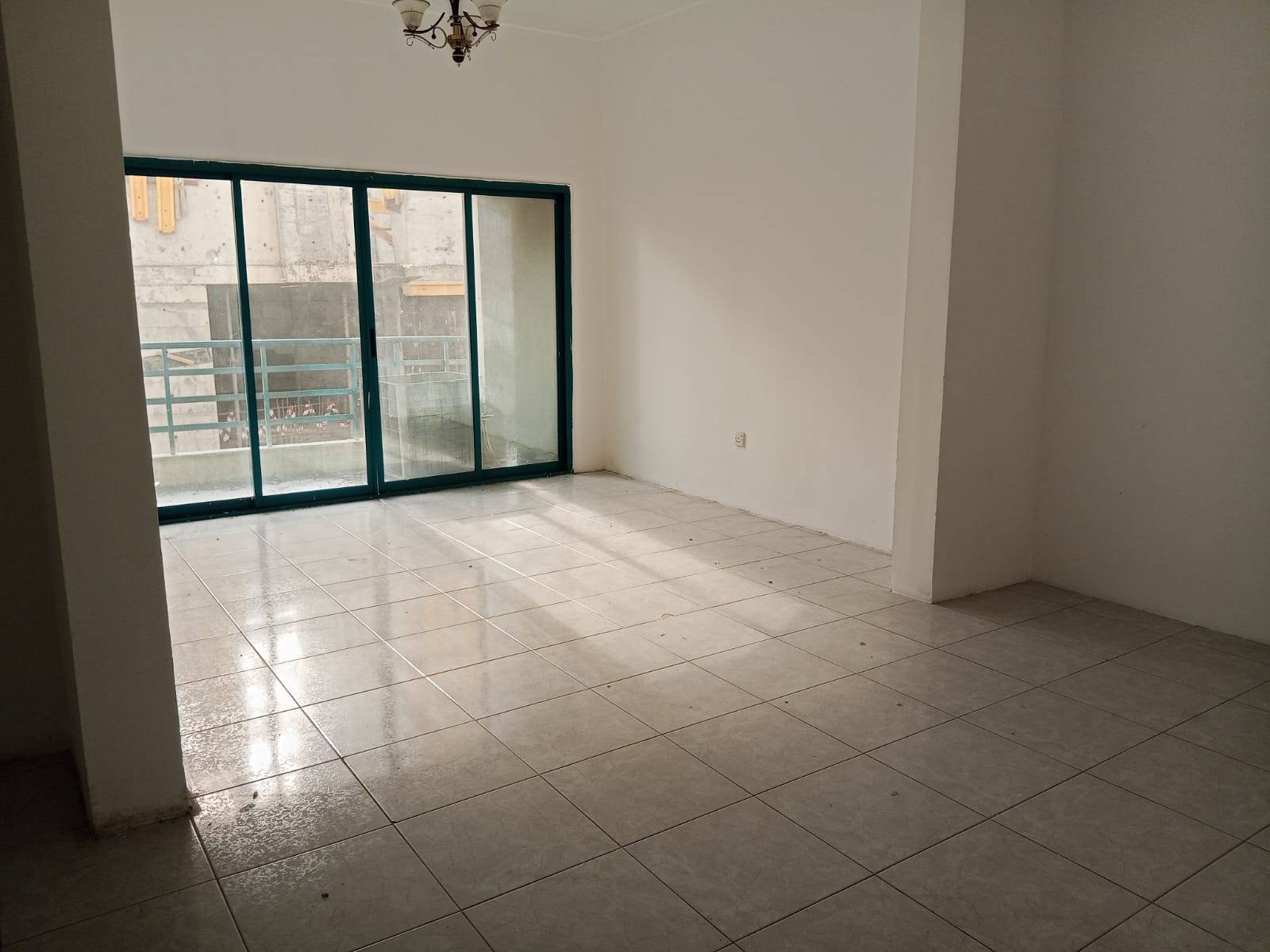 Apartment for rent in Al Majaz 3, 2 bedrooms and hall, large spaces, central AC, balcony with Al Qasba Canal view, family building, AED 35,000.