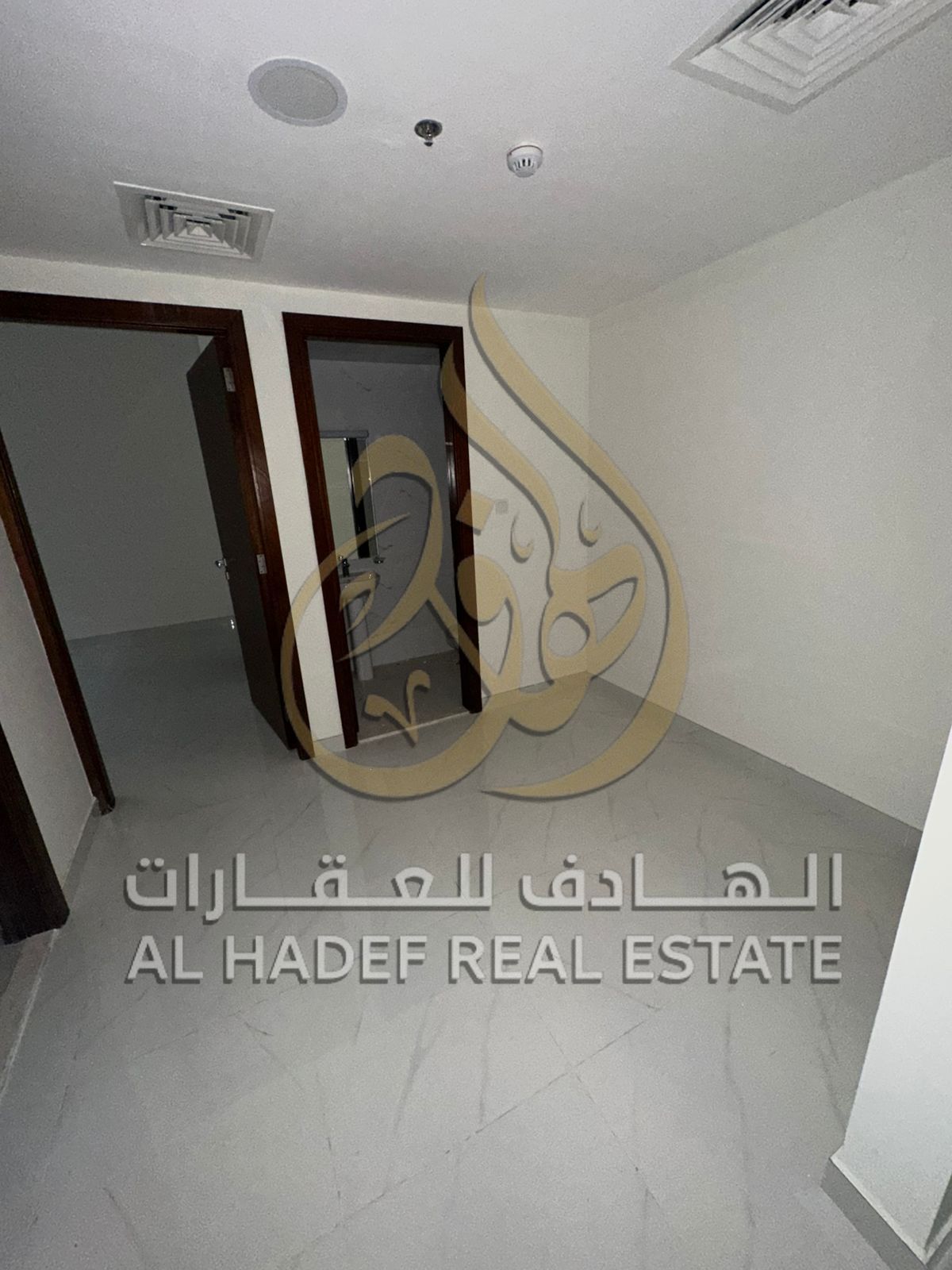 For annual rent, first tenant in Al Taawun Al Mamzar: one bedroom and living room, master with balcony, free parking, with payment facilities in 4 ins