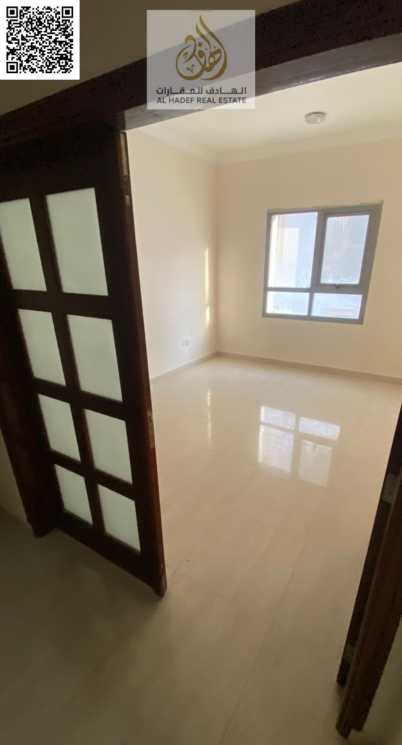 Large One Bedroom Apartment with Separate Living Room Distributor Spacious Layout Prime Location on Sheikh Ammar Street Near Al Shorooq Mall Al Rawda